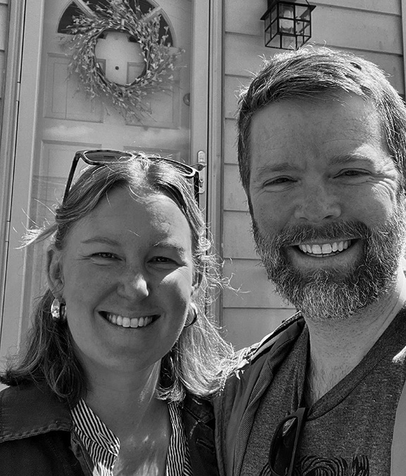 Picture of couple in front of house